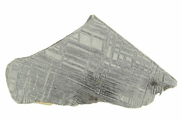 An acid etched slice of Muonionalusta meteorite showing a prominent widmanstätten pattern